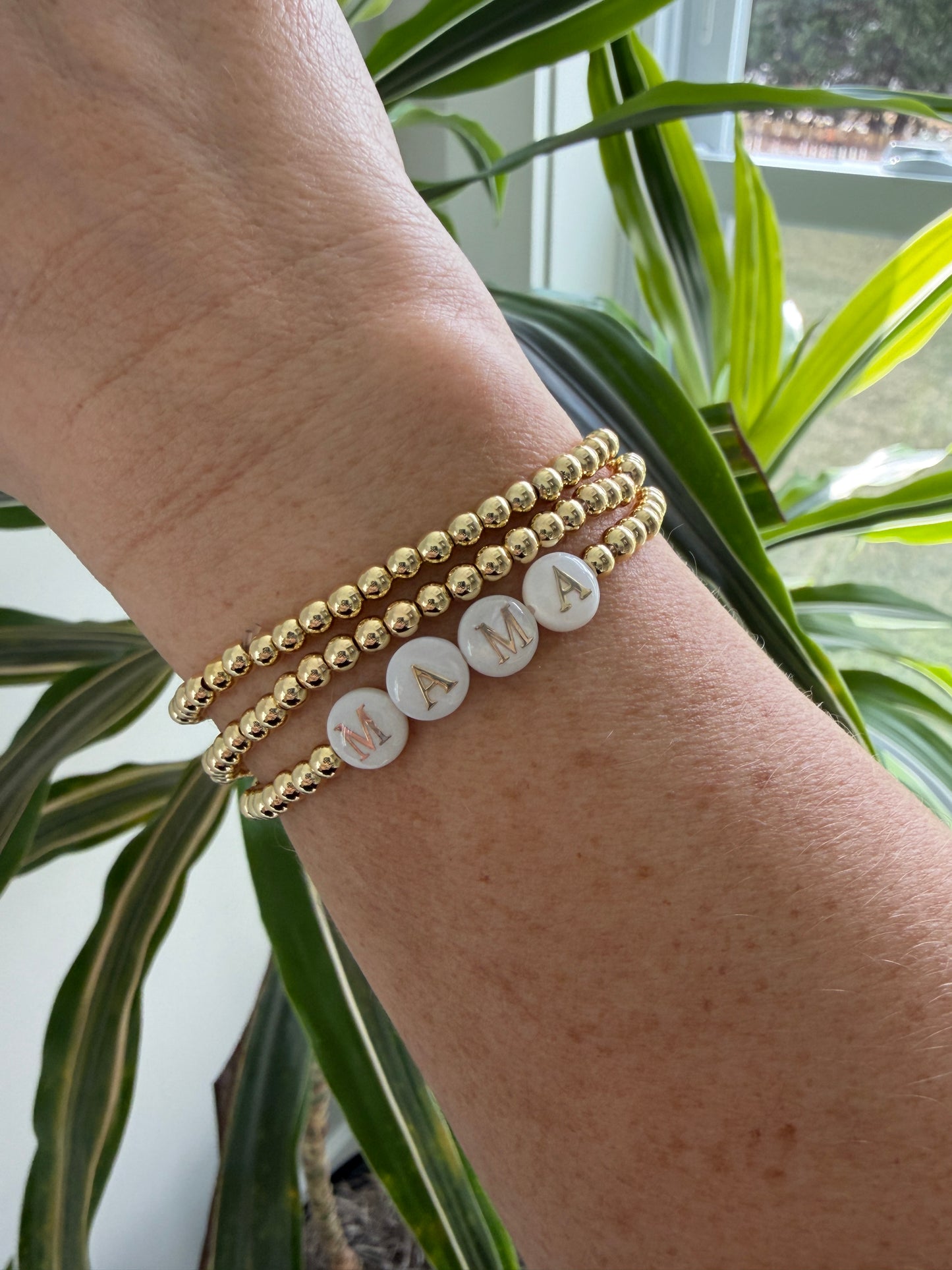 18k Gold-filled mama bracelet stacked with minimalist gold bracelets