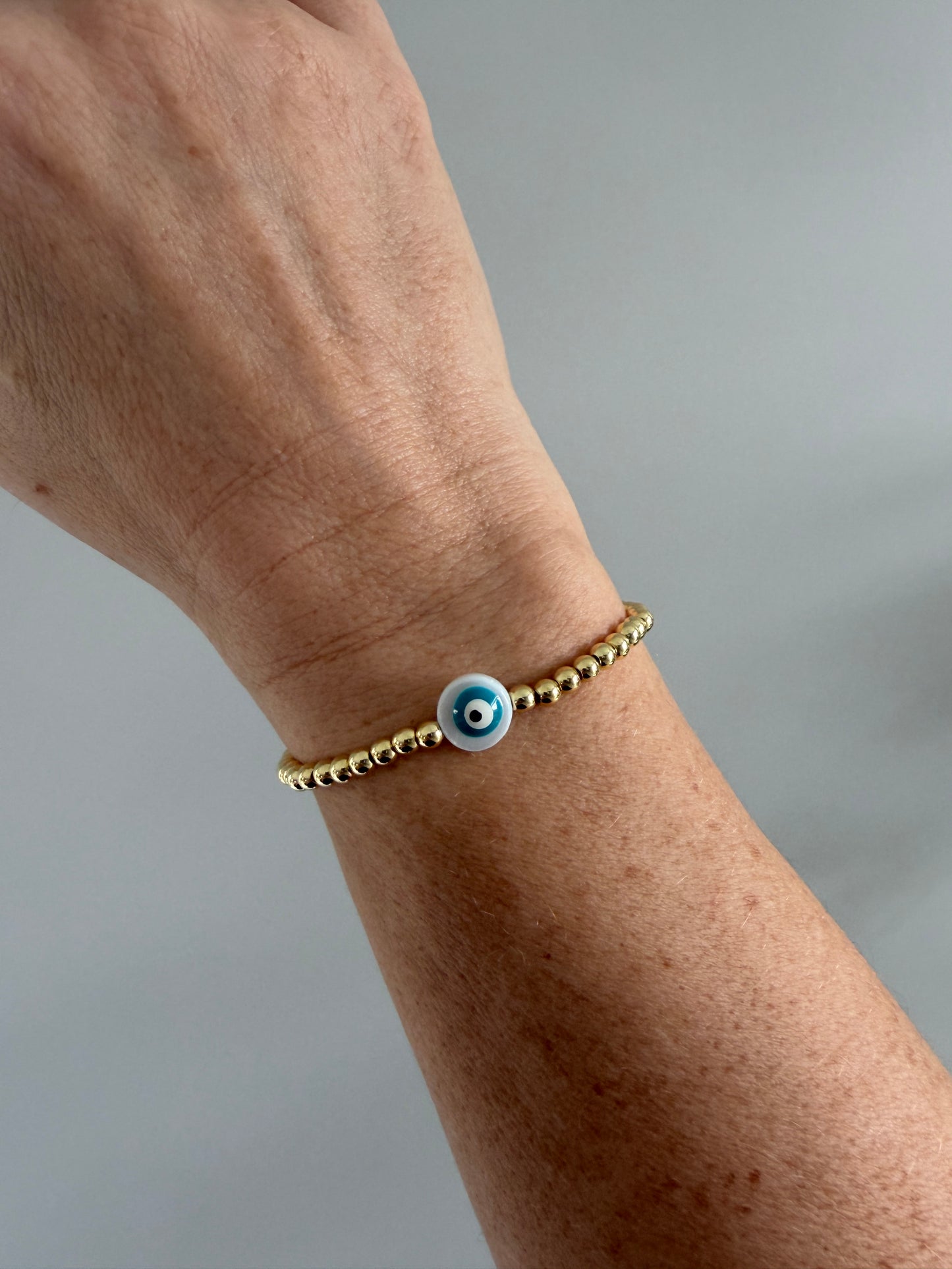Handmade 18K gold-filled beaded bracelet with evil eye charm