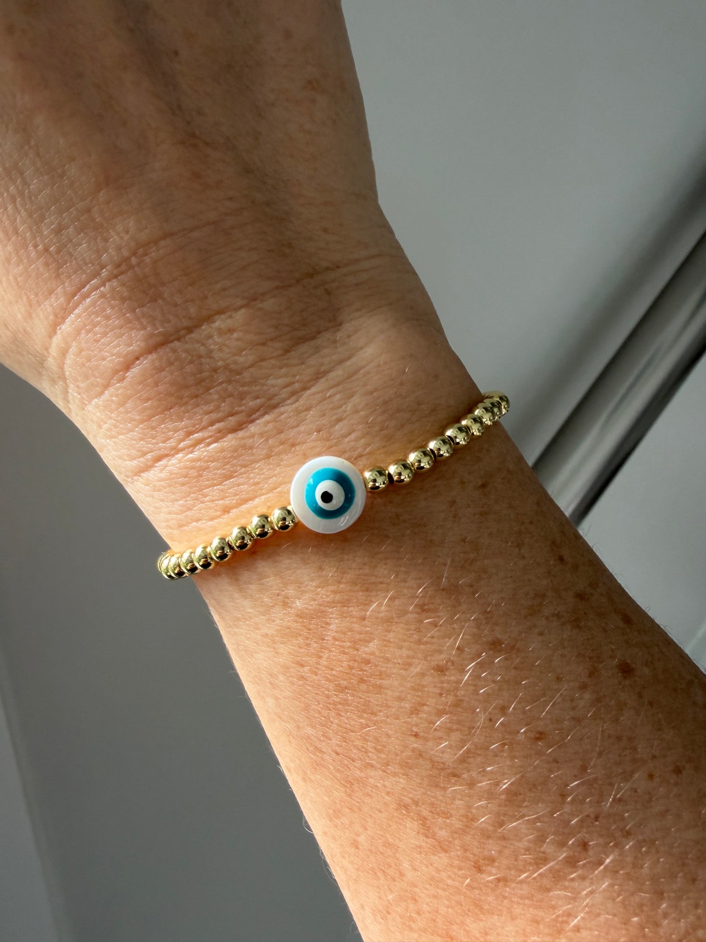 Handmade 18K gold-filled beaded bracelet with evil eye charm