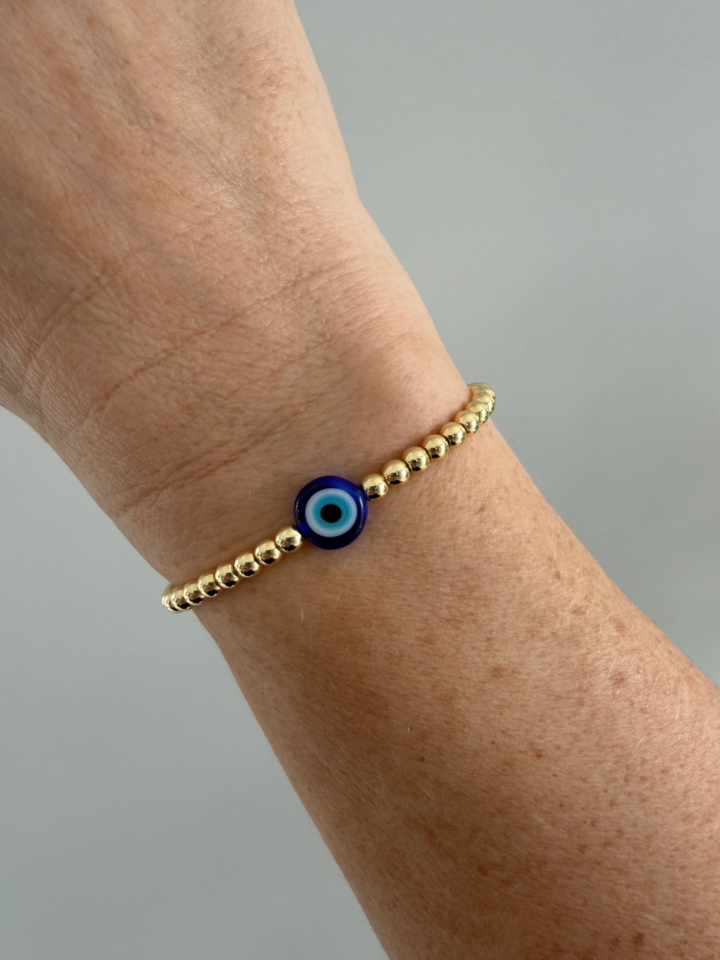 Handmade 18K gold-filled beaded bracelet with evil eye charm