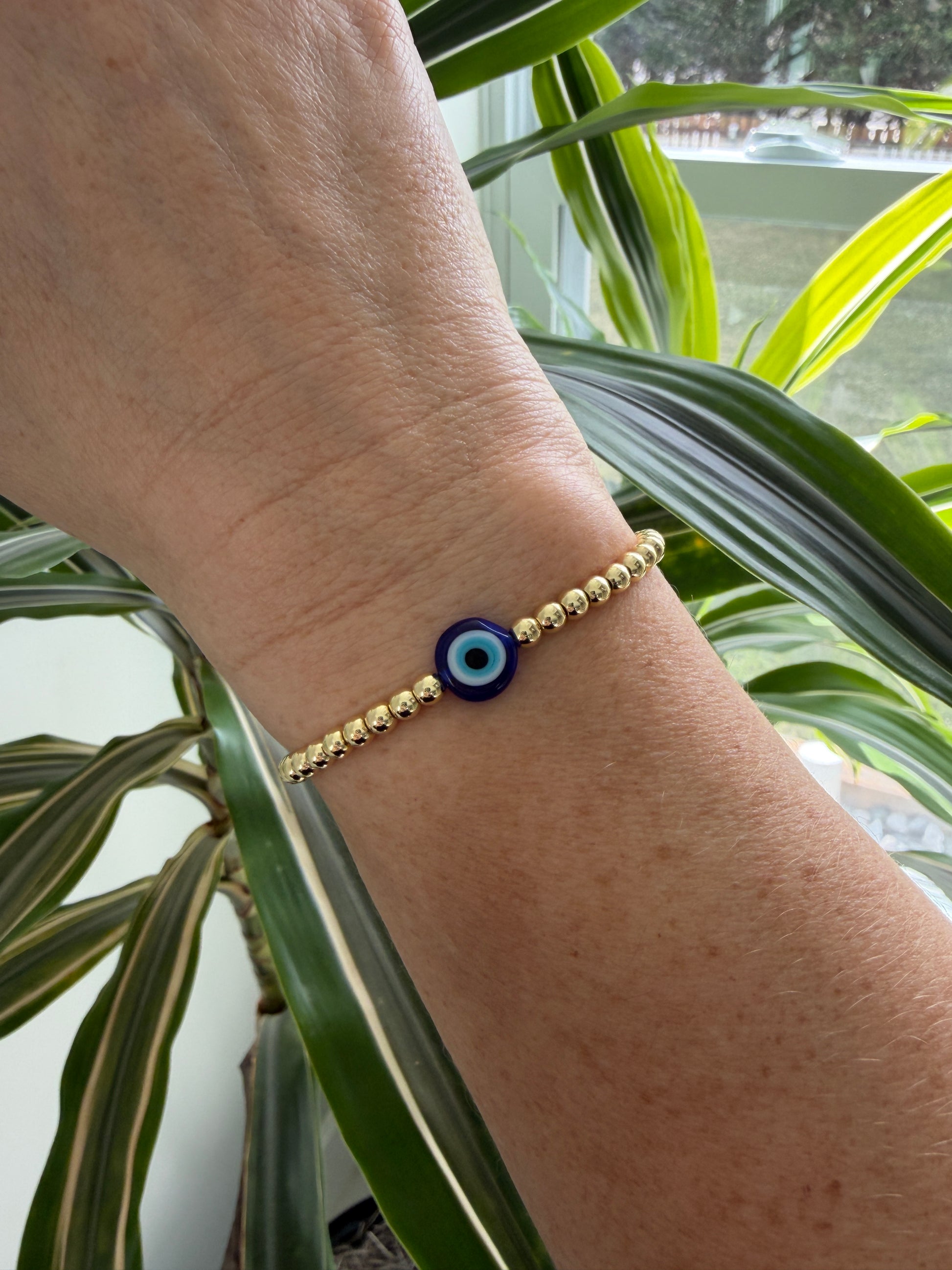 Handmade 18K gold-filled beaded bracelet with evil eye charm