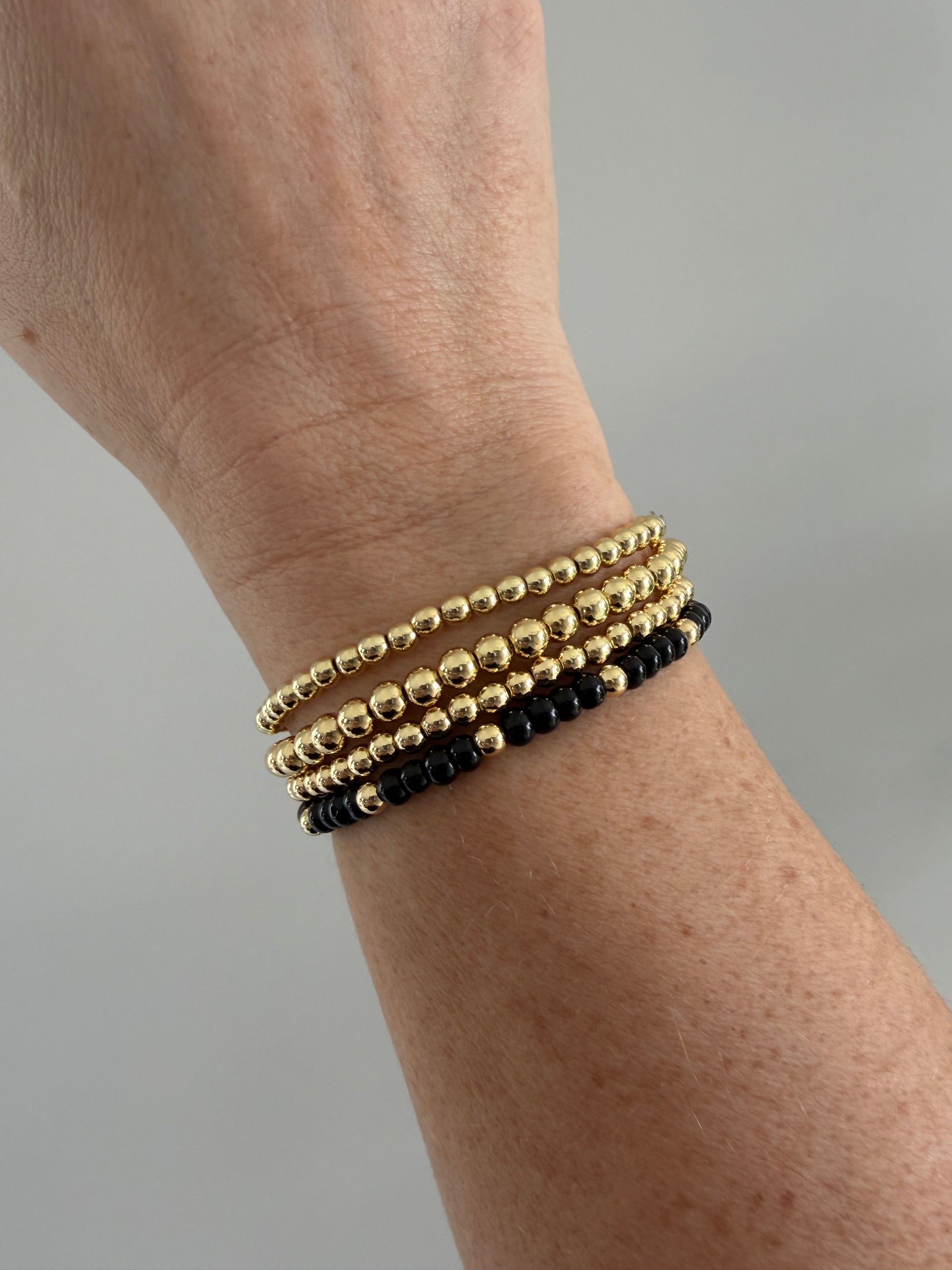 18K gold-filled beaded bracelet with black bead accents