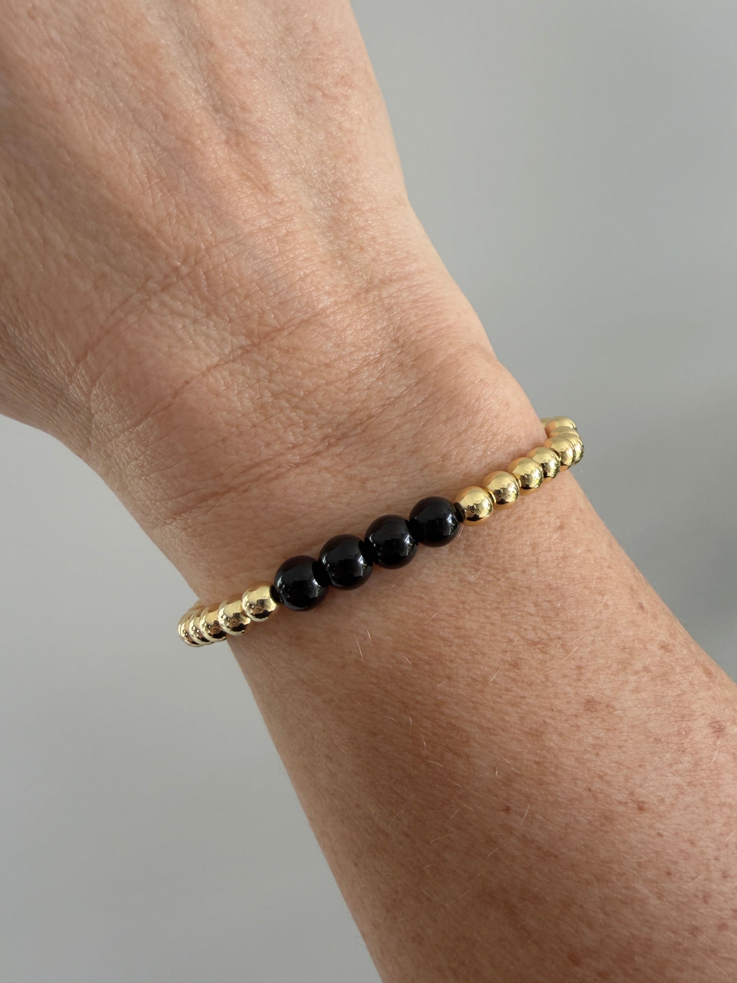 18K gold-filled beaded bracelet with black bead accents