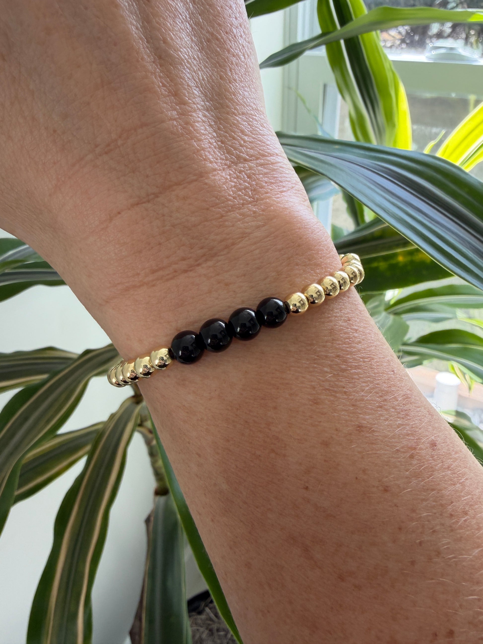 Handmade 18K gold-filled bracelet featuring black accent beads