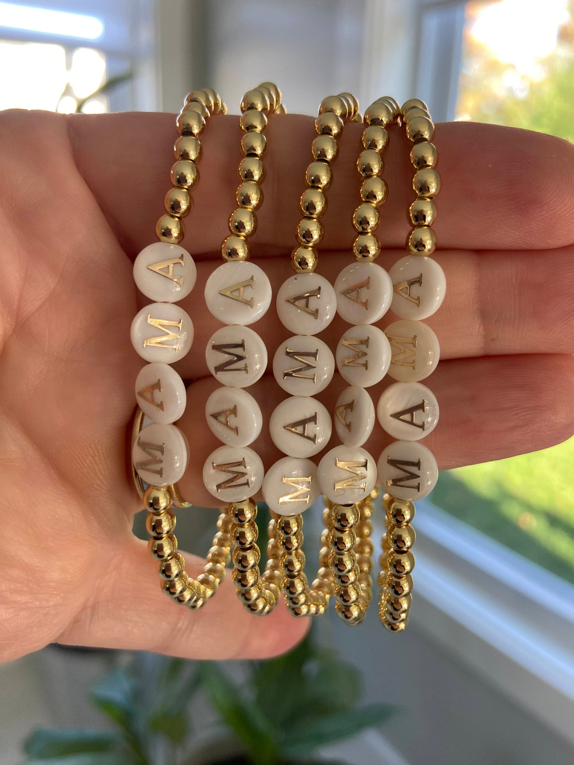 18k Gold-filled mama bracelet stacked with minimalist gold bracelets